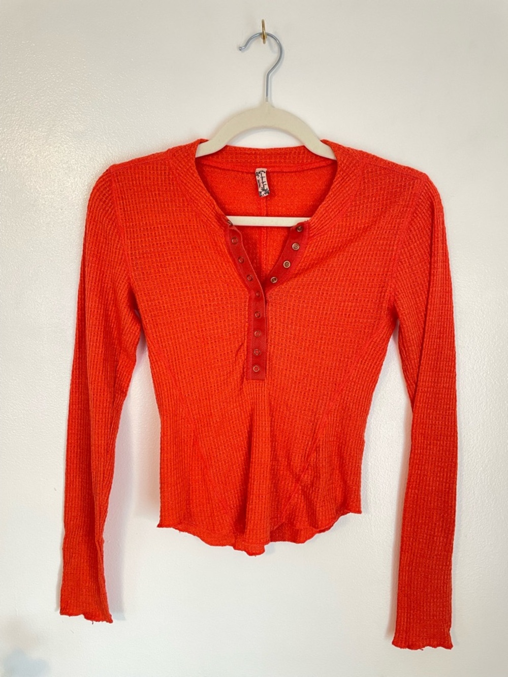 FREE PEOPLE orange waffle knit long sleeve top with snap buttons size xs